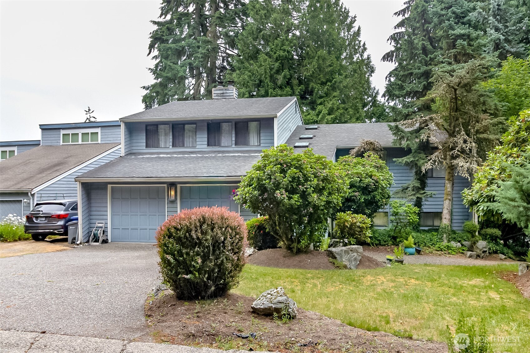 22121 4th Avenue Southeast Bothell, WA 98021 - Photo 1 of 22 a front view of a house with a garden and plants