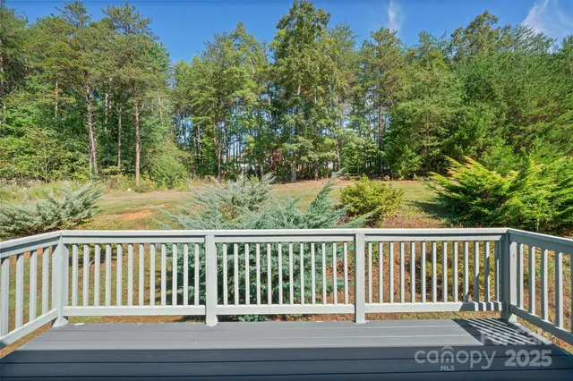 a view of balcony with wooden floor