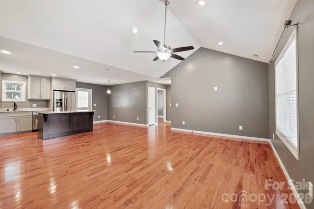 a view of a kitchen with a kitchen and wooden floor