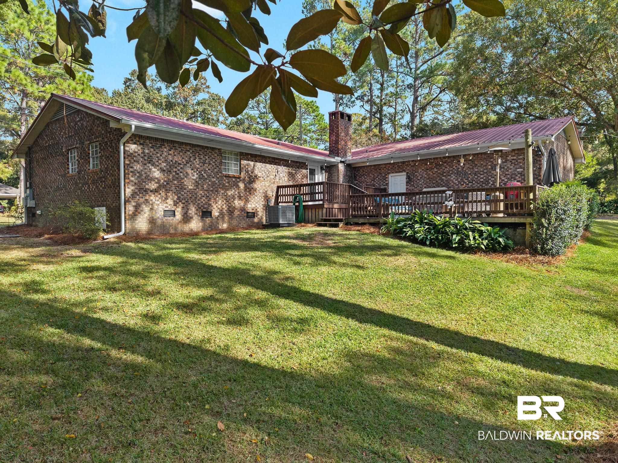 4 Rally Road Spanish Fort, AL 36527 - Photo 35 of 41 Rear view of house with a deck, crawl space, brick siding, and a chimney