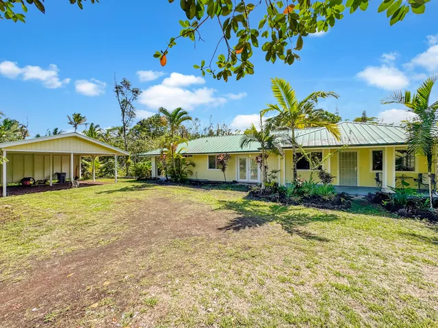 a front view of a house with a yard and porch