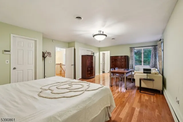 a bathroom with a granite countertop sink a toilet and a shower