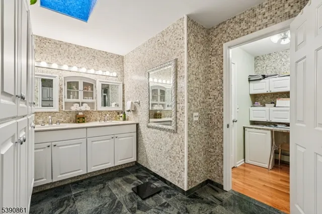 a bedroom with a bed and a potted plant