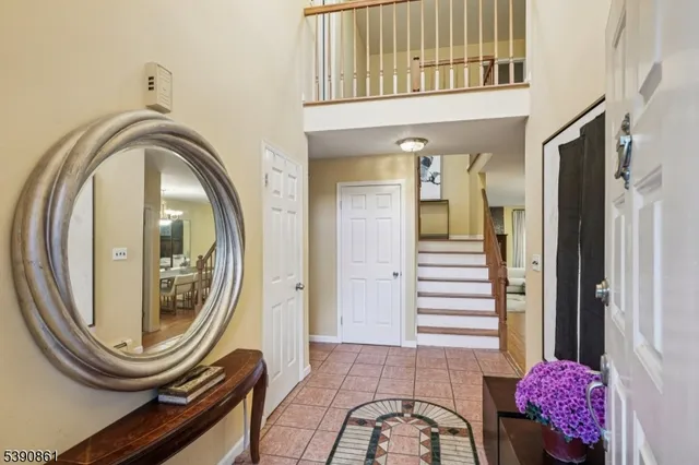 a view of a dining room with furniture wooden floor and chandelier