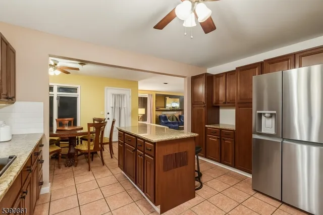 a kitchen with a stove a refrigerator and a sink
