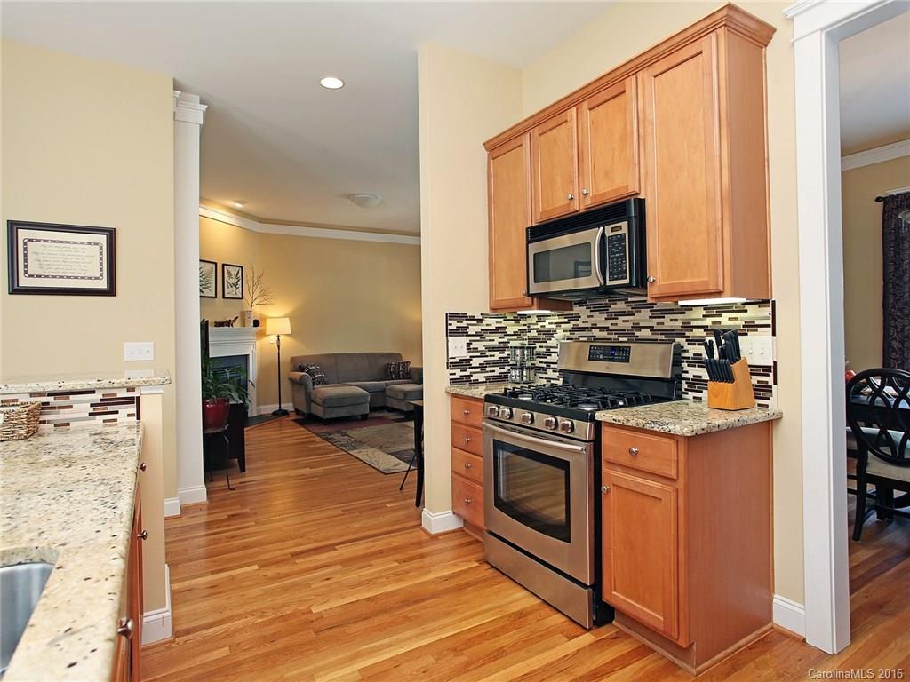 1865 2nd Baxter Crossing Fort Mill, SC 29708 - Photo 13 of 24 a kitchen with stainless steel appliances granite countertop a stove and a sink