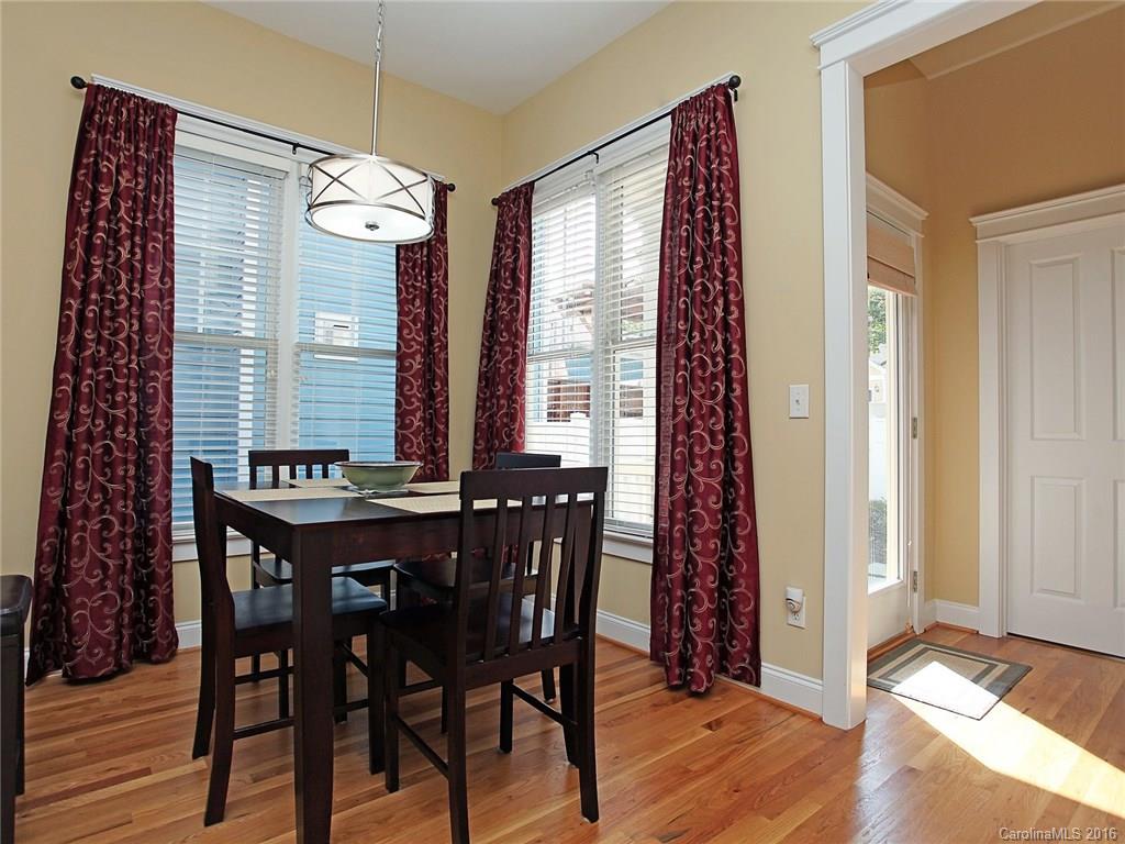 1865 2nd Baxter Crossing Fort Mill, SC 29708 - Photo 14 of 24 a view of a dining room with furniture window and wooden floor