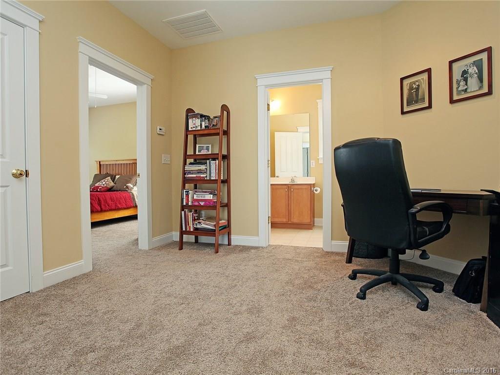 1865 2nd Baxter Crossing Fort Mill, SC 29708 - Photo 15 of 24 a view of a workspace with furniture and a cabinet