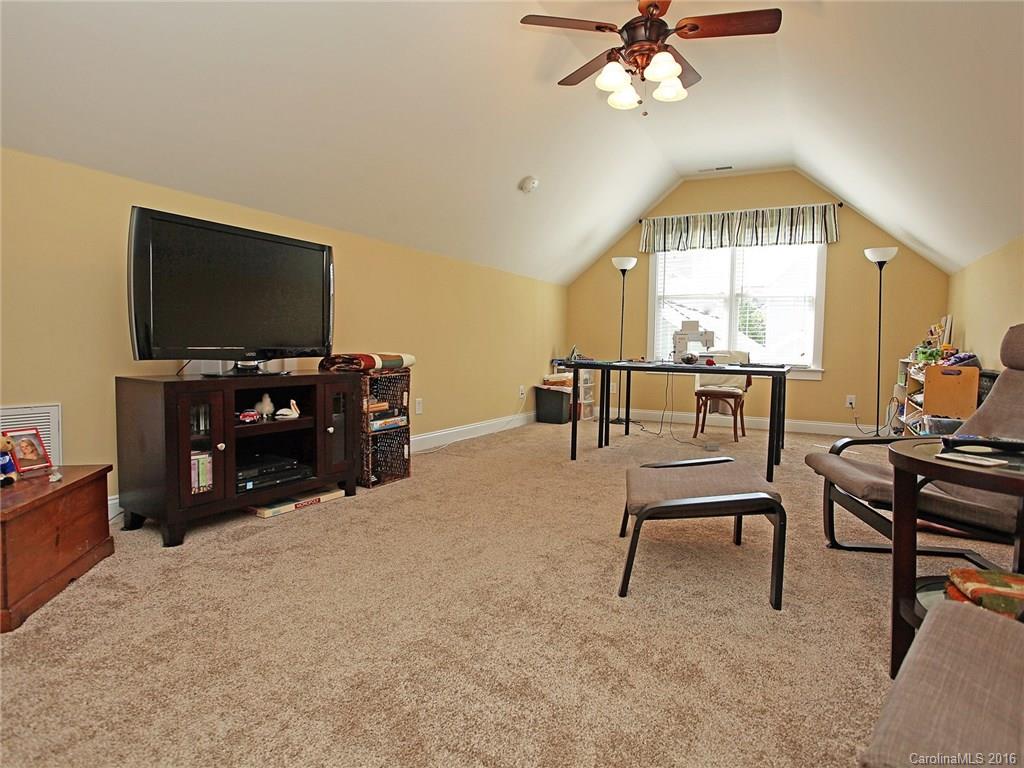 1865 2nd Baxter Crossing Fort Mill, SC 29708 - Photo 16 of 24 a living room with furniture and a flat screen tv