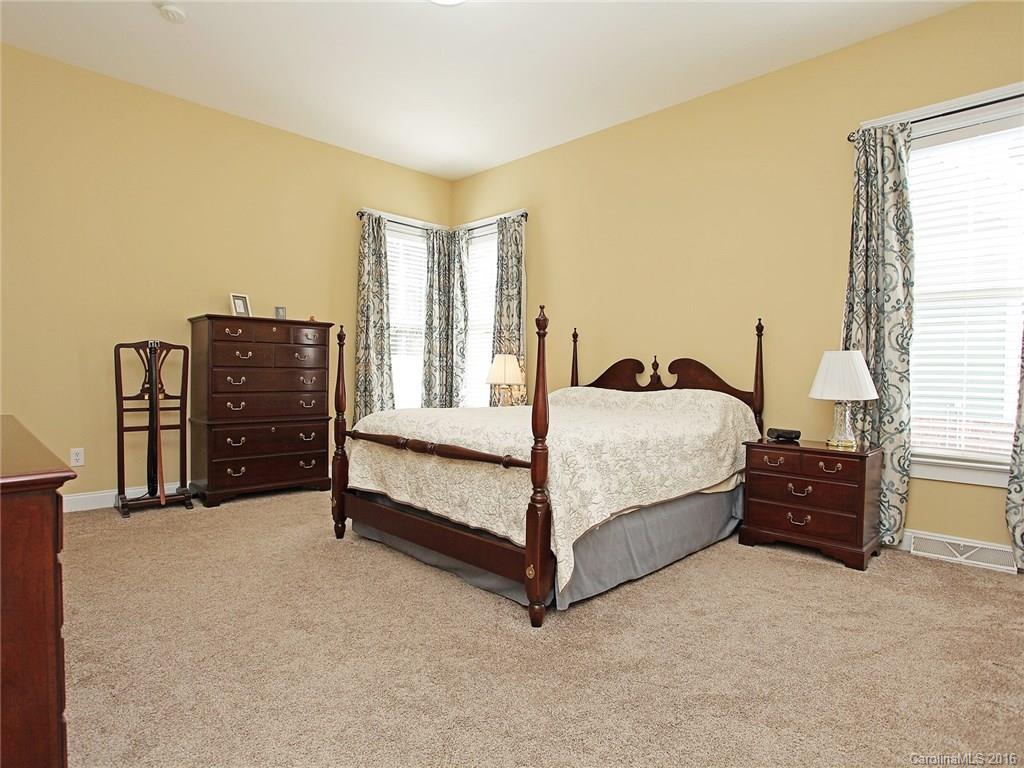 1865 2nd Baxter Crossing Fort Mill, SC 29708 - Photo 17 of 24 a bedroom with a bed and dresser
