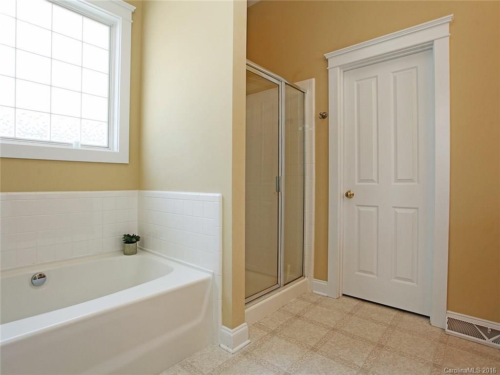 1865 2nd Baxter Crossing Fort Mill, SC 29708 - Photo 19 of 24 a bathroom with a bathtub and a shower