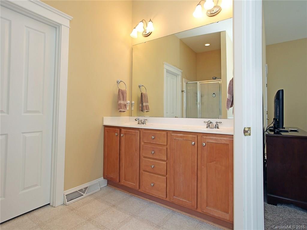 1865 2nd Baxter Crossing Fort Mill, SC 29708 - Photo 20 of 24 a bathroom with a double vanity sink and mirror