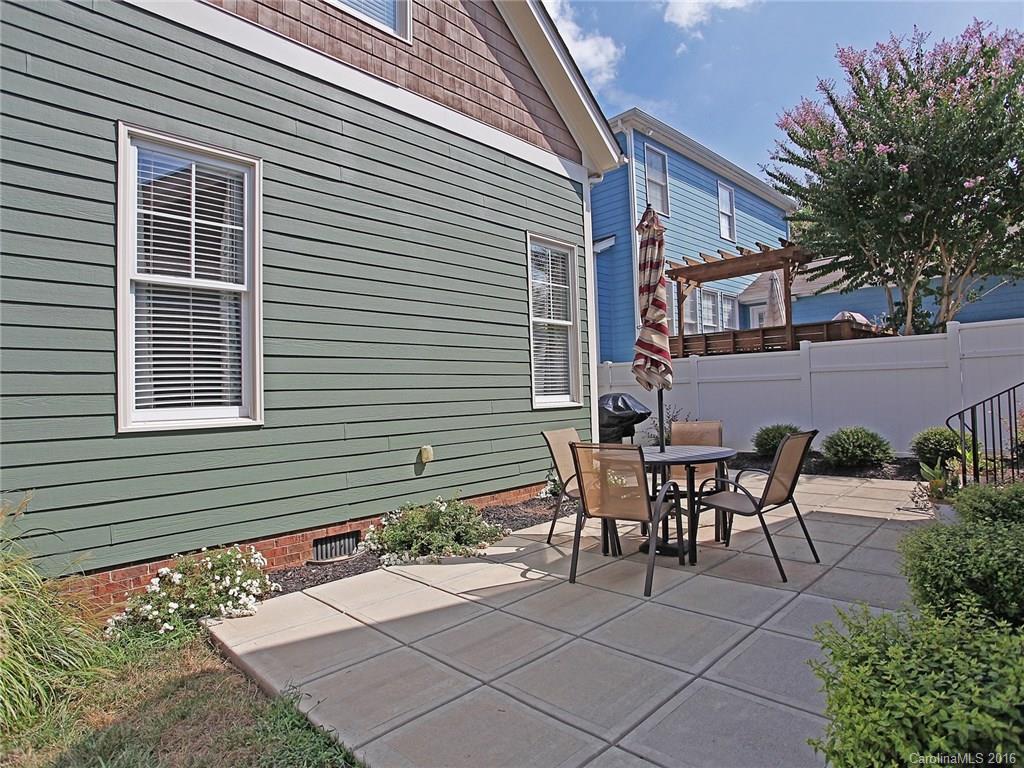 1865 2nd Baxter Crossing Fort Mill, SC 29708 - Photo 4 of 24 a view of a house with patio and a yard
