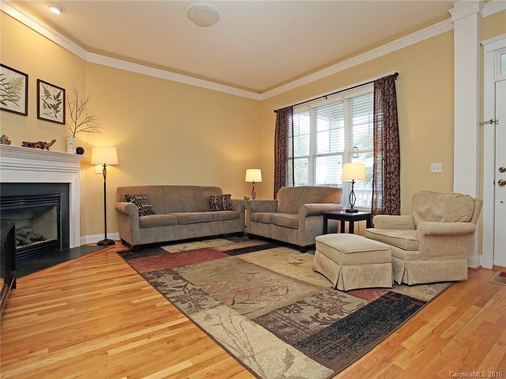 1865 2nd Baxter Crossing Fort Mill, SC 29708 - Photo 7 of 24 a living room with furniture and a fireplace