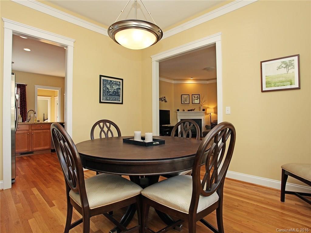 1865 2nd Baxter Crossing Fort Mill, SC 29708 - Photo 8 of 24 a view of a dining room with furniture and wooden floor