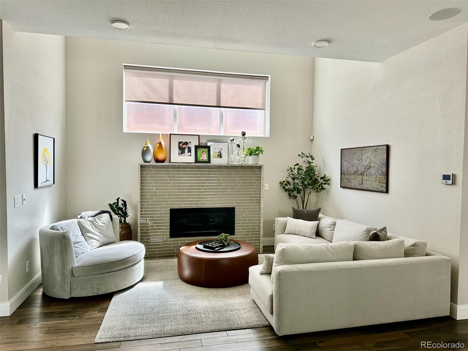76 Niagara Street Denver, CO 80230 - Photo 12 of 44 a living room with furniture and a fireplace