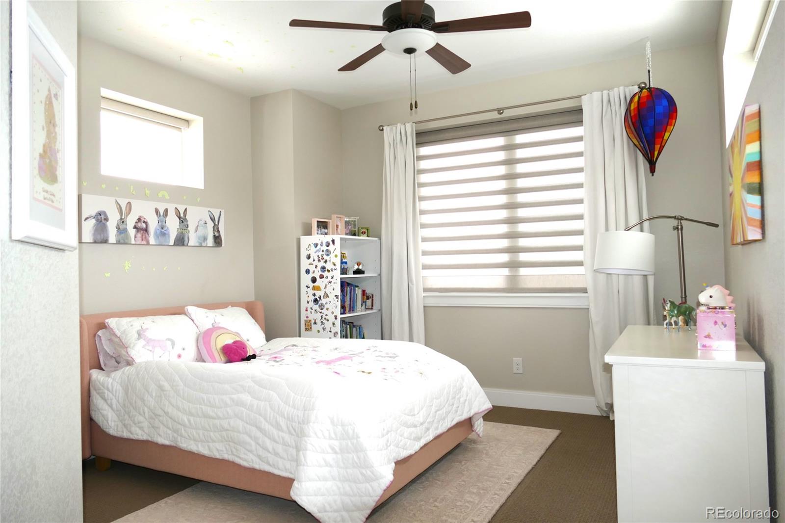 76 Niagara Street Denver, CO 80230 - Photo 20 of 44 a bedroom with a bed and a window