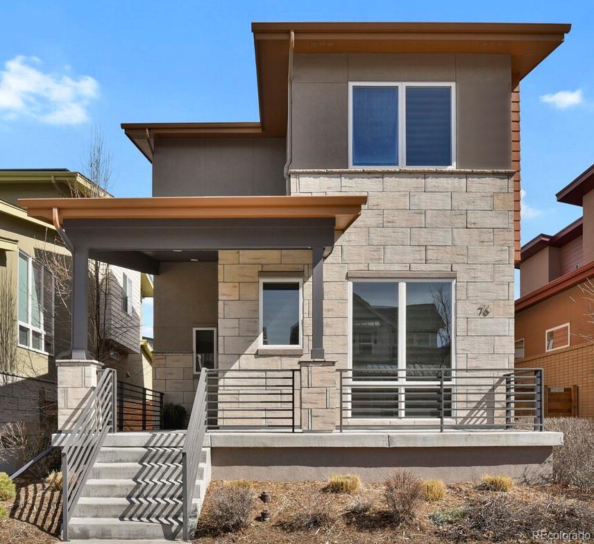 76 Niagara Street Denver, CO 80230 - Photo 2 of 44 a view of a house with a large window and wooden fence