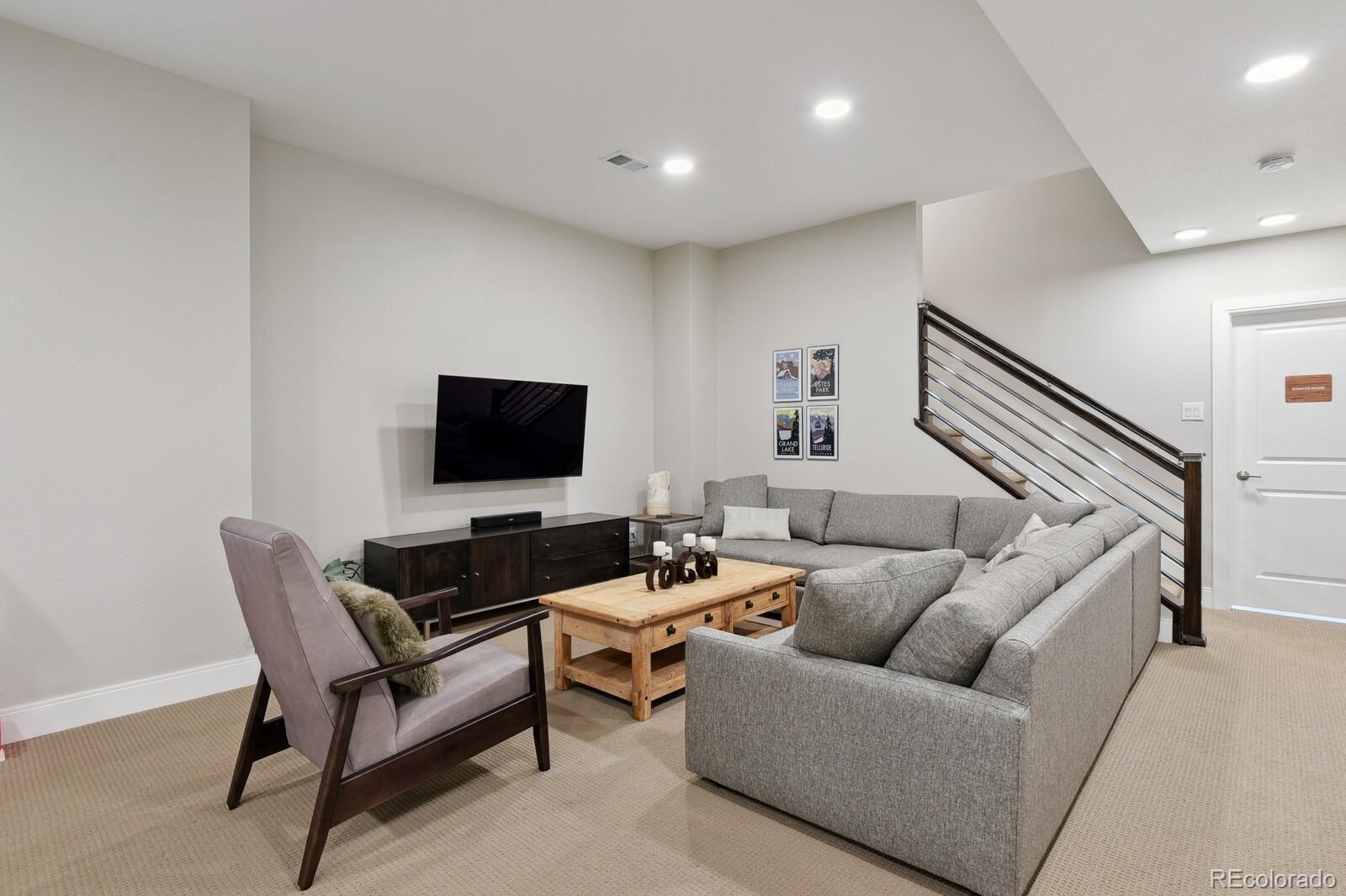 76 Niagara Street Denver, CO 80230 - Photo 23 of 44 a living room with furniture and a flat screen tv