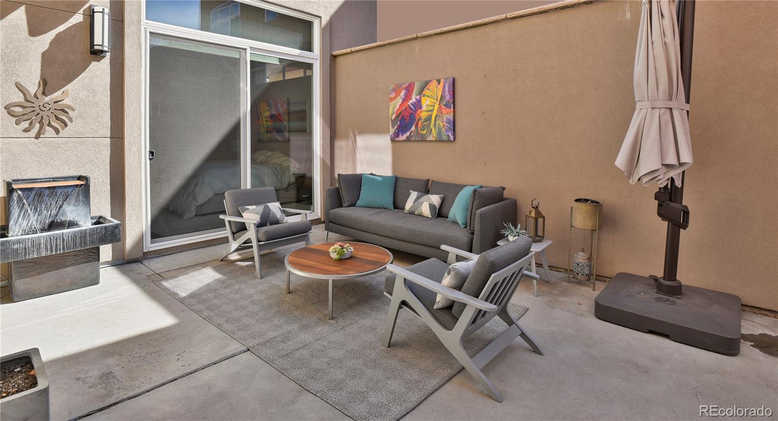 76 Niagara Street Denver, CO 80230 - Photo 32 of 44 a living room with furniture a rug and a window