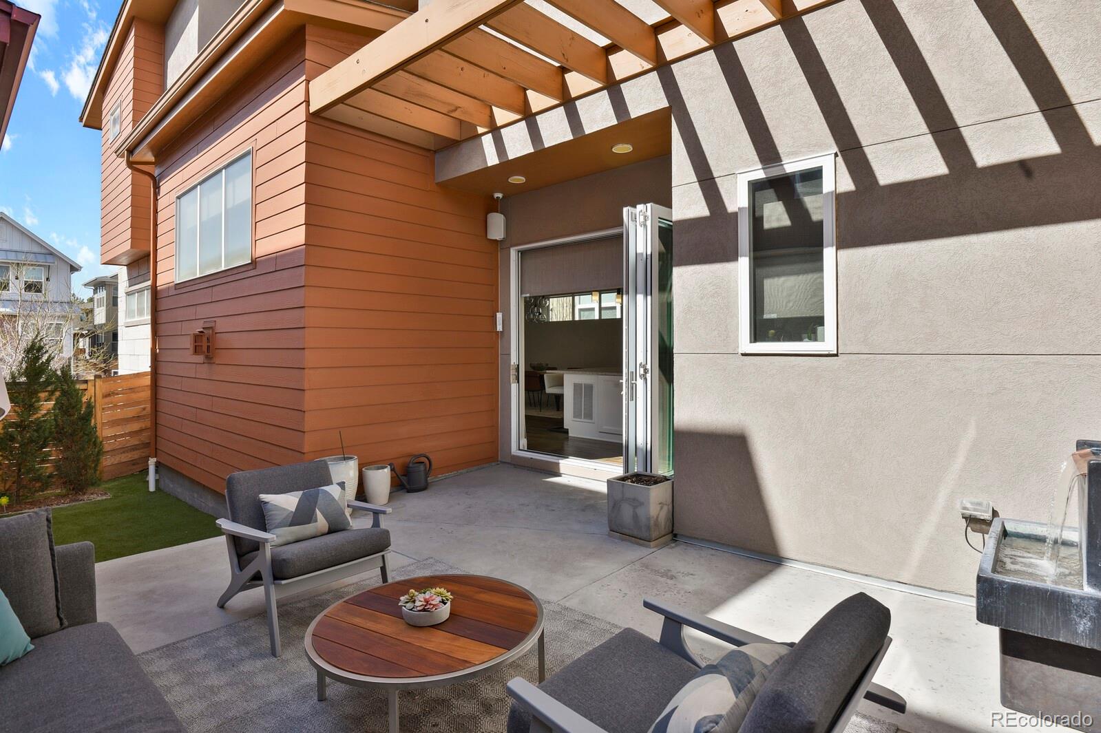 76 Niagara Street Denver, CO 80230 - Photo 33 of 44 a view of a patio with couches table and chairs