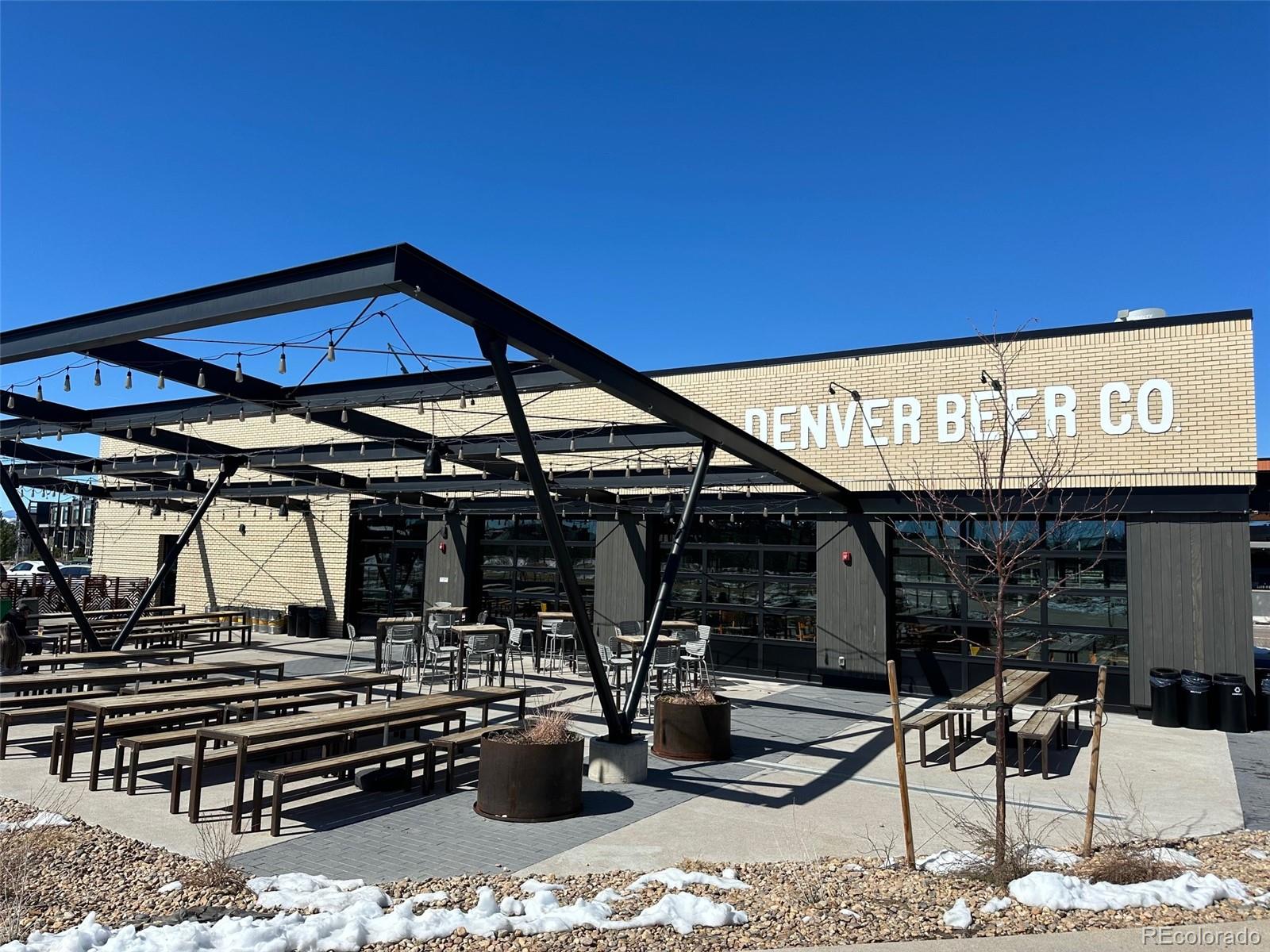 76 Niagara Street Denver, CO 80230 - Photo 39 of 44 a view of a patio with a table and chairs under an umbrella