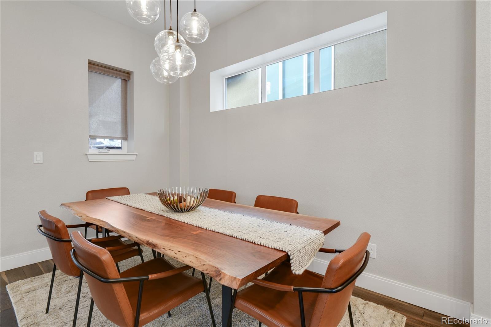 76 Niagara Street Denver, CO 80230 - Photo 8 of 44 a view of a dining room with furniture and chandelier
