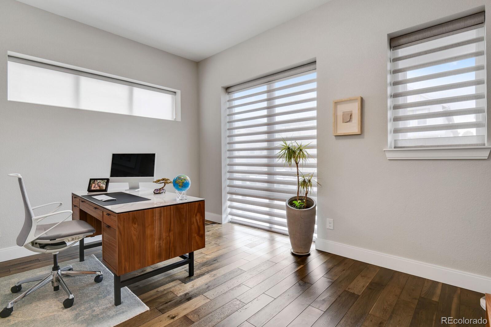 76 Niagara Street Denver, CO 80230 - Photo 9 of 44 a view of a workspace with furniture and a window