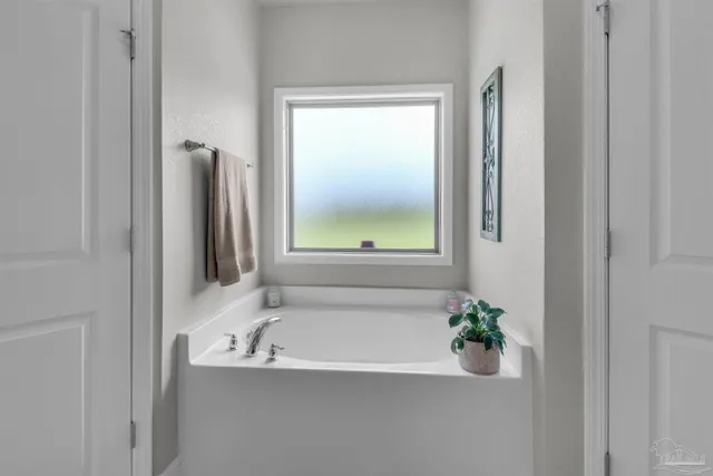 a bathroom with a bathtub and shower