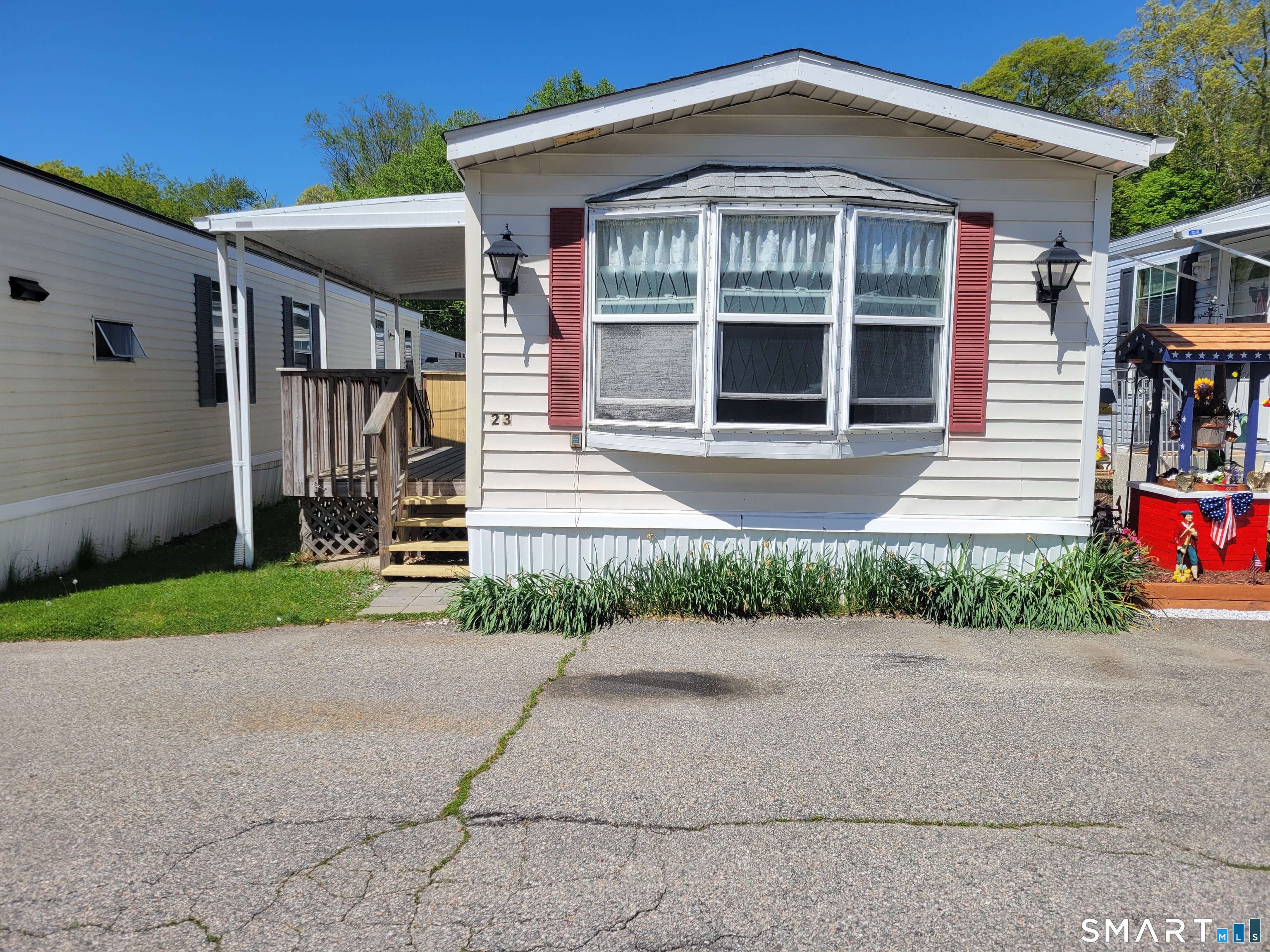 1290 N Road Groton, CT 06340 - Photo 1 of 11 a front view of a house with a yard and a garage