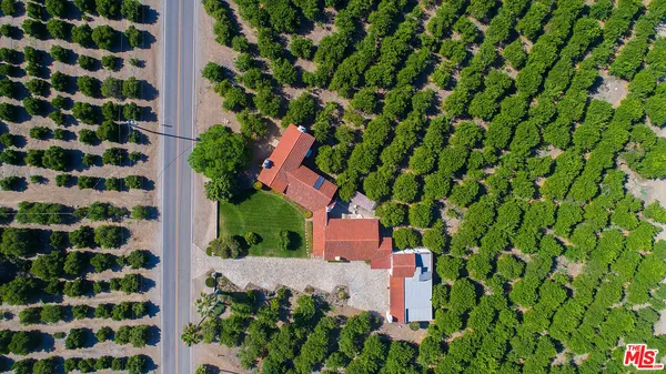 a view of a balcony with mountain view and wooden floor