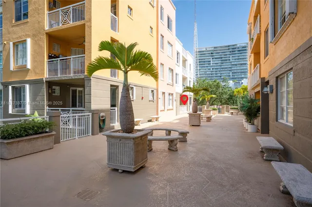 a kitchen with granite countertop a stove sink and microwave
