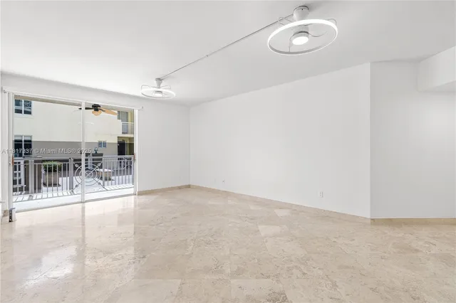 a bathroom with a shower sink vanity mirror and toilet