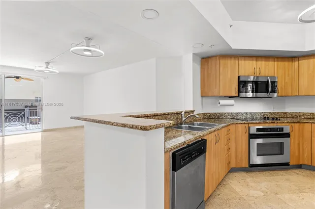 a bathroom with a tub a sink and mirror