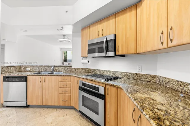 a bathroom with a granite countertop bathtub shower sink vanity and mirror