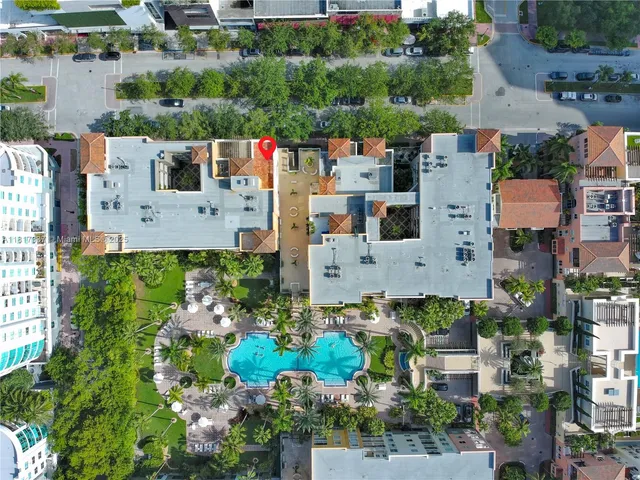 a view of a kitchen with a sink and a refrigerator