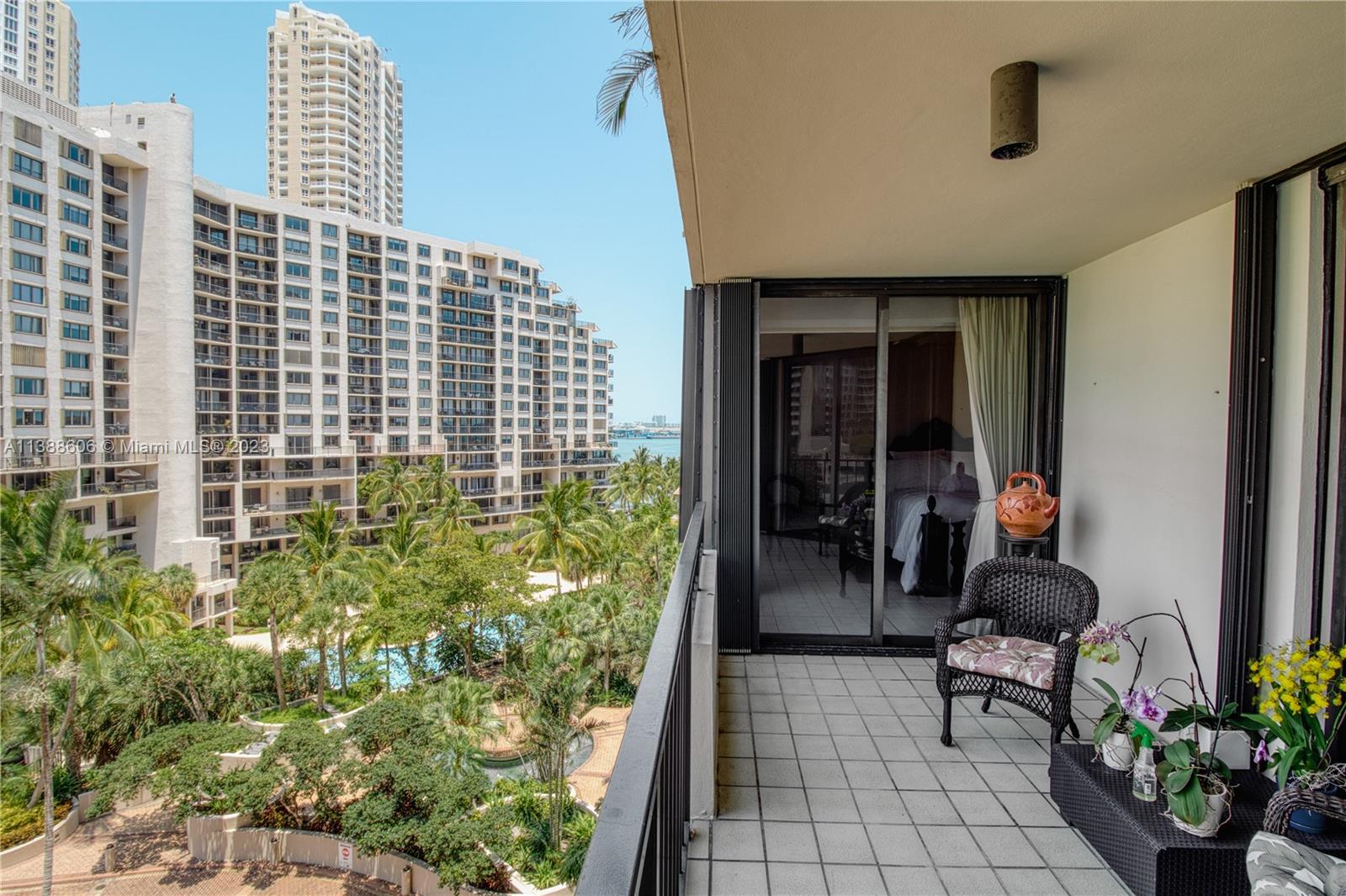 a man sitting on a bench in front of a building