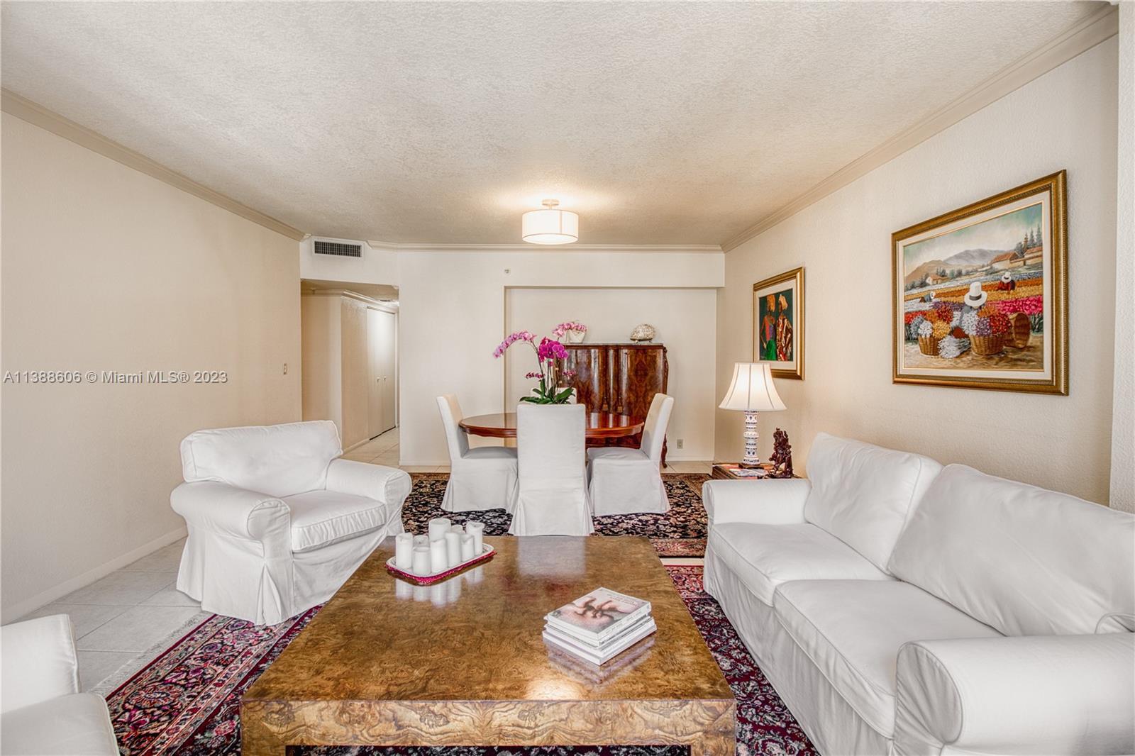 520 Brickell Key Drive, Unit A810 Miami, FL 33131 - Photo 11 of 20 a living room with furniture and wooden floor