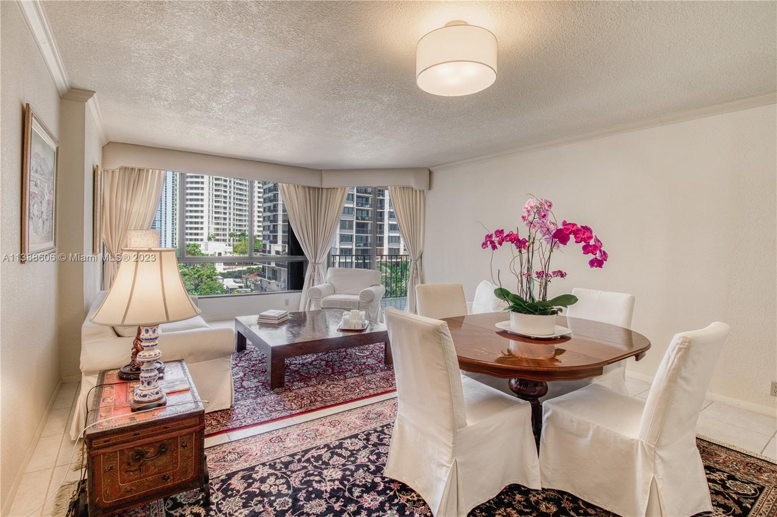 520 Brickell Key Drive, Unit A810 Miami, FL 33131 - Photo 14 of 20 a living room with furniture and wooden floor