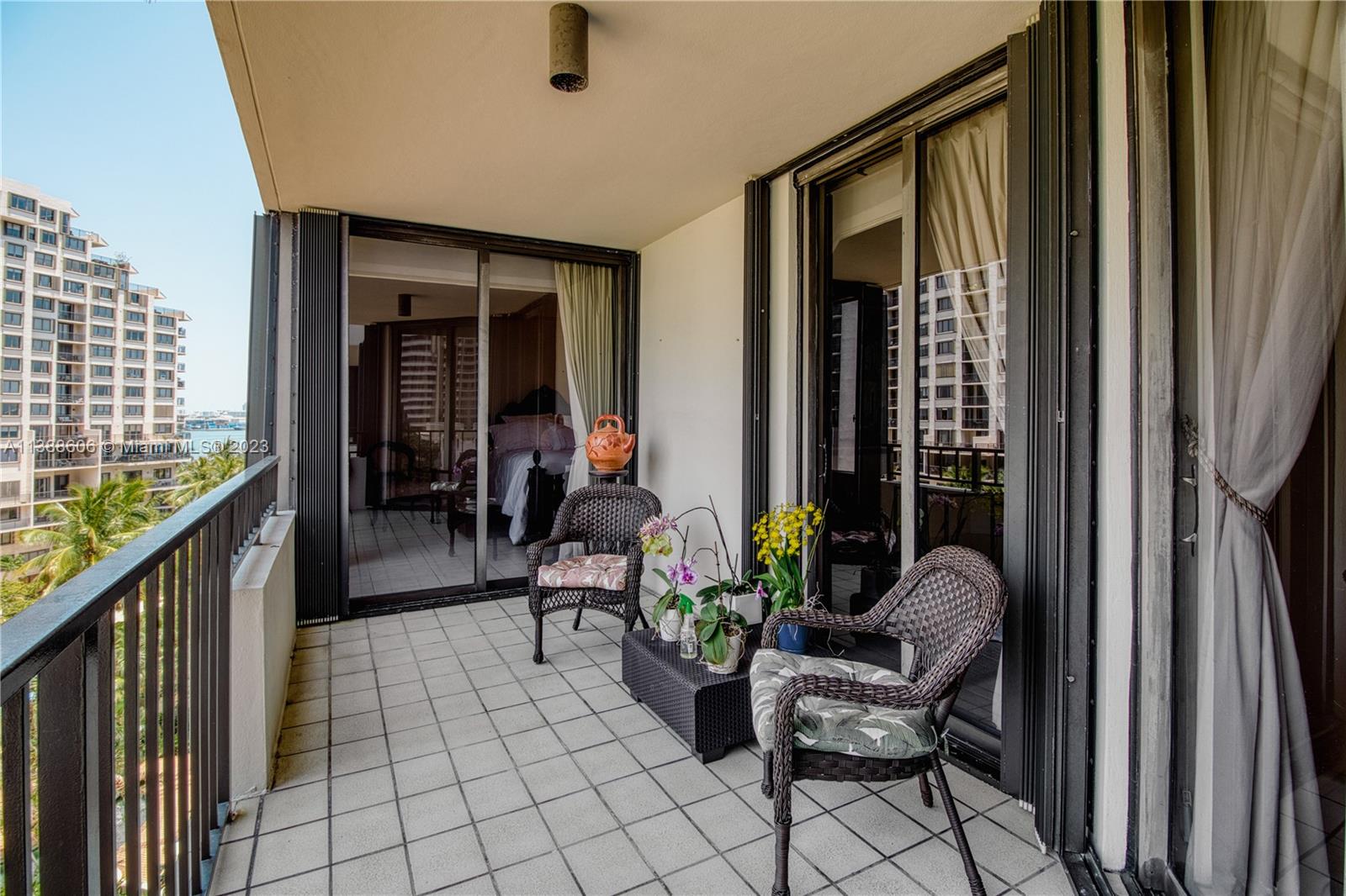 520 Brickell Key Drive, Unit A810 Miami, FL 33131 - Photo 20 of 20 a balcony with furniture and a potted plant