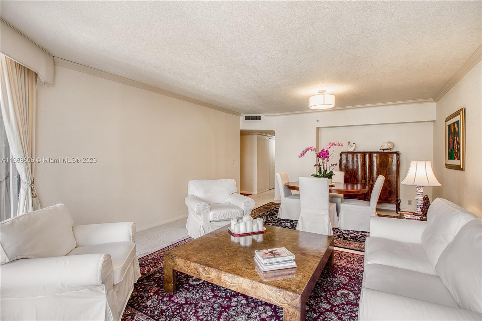 520 Brickell Key Drive, Unit A810 Miami, FL 33131 - Photo 10 of 20 a living room with furniture and a couch