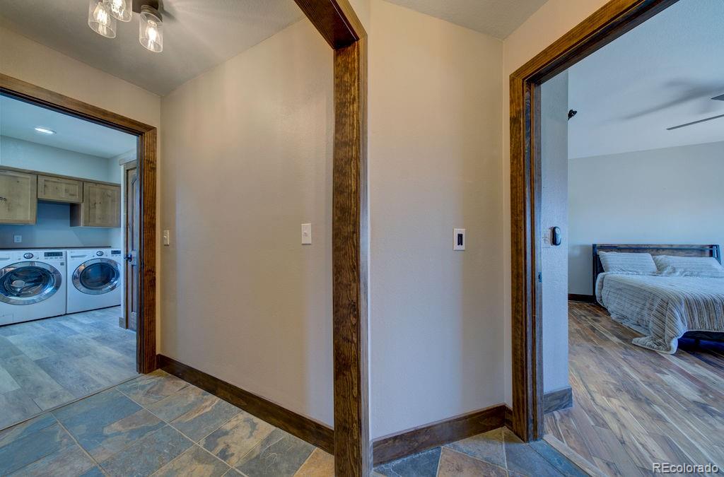 14965 Tanner Trail Elbert, CO 80106 - Photo 18 of 40 a view of a bedroom from a hallway