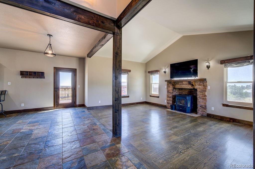 14965 Tanner Trail Elbert, CO 80106 - Photo 4 of 40 a view of living room with furniture and fireplace