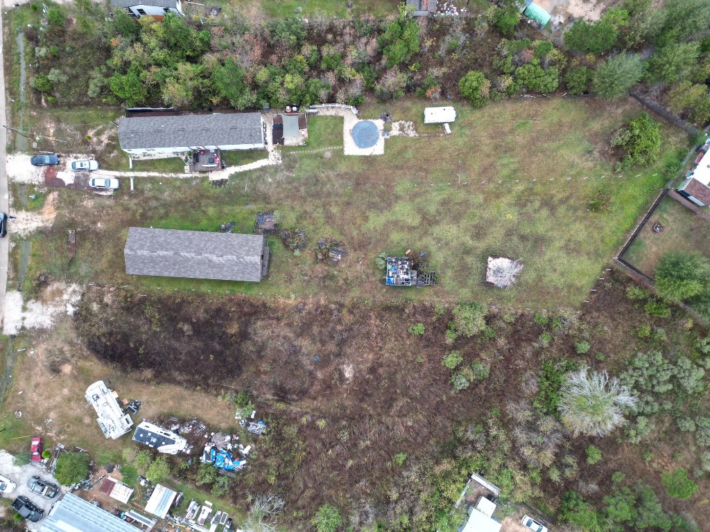 364 West 5102 H Road West Cleveland, TX 77327 - Photo 11 of 13 a view of a house with a yard