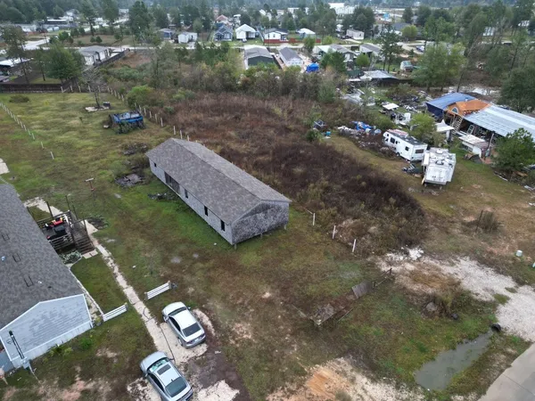 a aerial view of a house with a yard