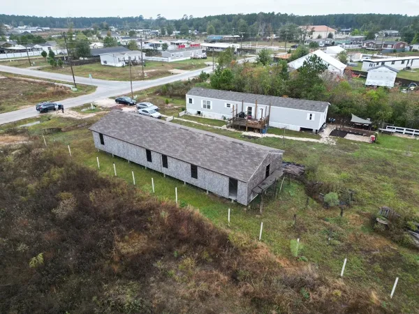 an aerial view of a house with a lake view