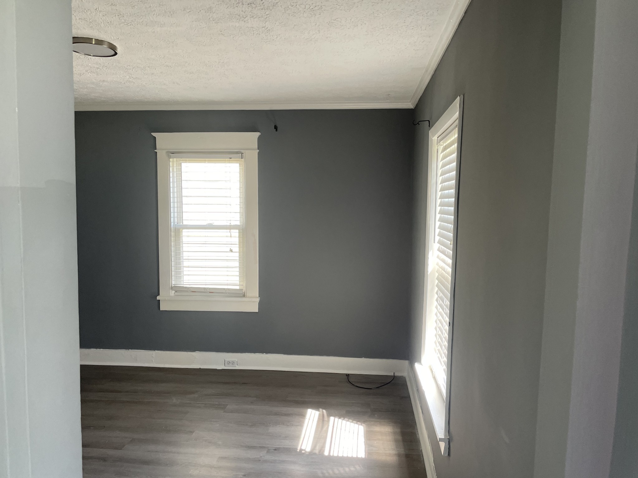 914 Locklayer Street Nashville, TN 37208 - Photo 2 of 7 an empty room with wooden floor and windows