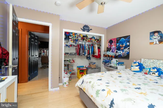 a bed room with a bed and a desk