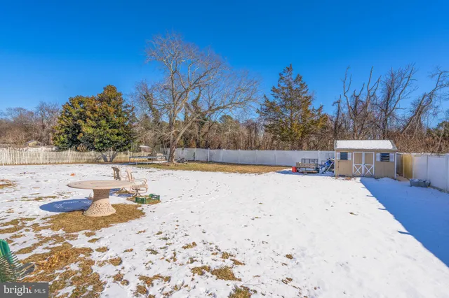 an aerial view of a swimming pool with outdoor seating