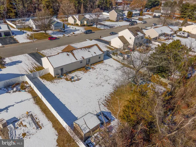 an aerial view of a yard with horses